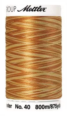 *4880-9933//AMBER MIX//POLYSHEEN VARIGATED MULTI//100% POLYESTER//875 YARDS//40 WEIGHT//METTLER
