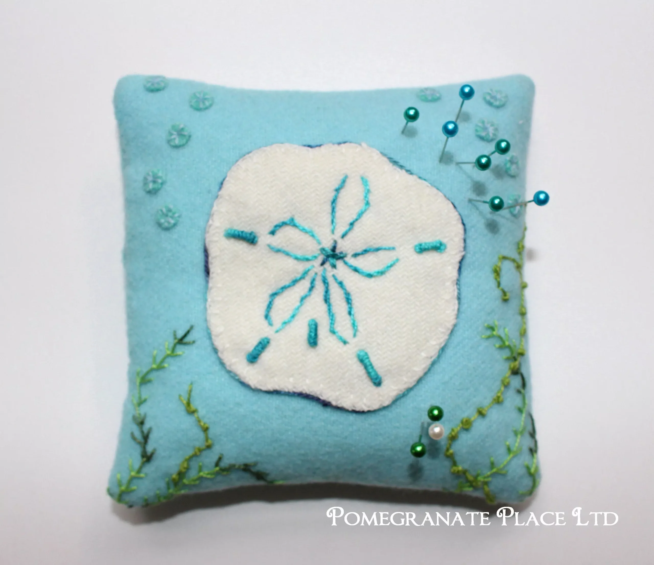 Wool Sand Dollar Pincushion Pattern by Pomegranate Place Ltd. Exclusive pattern ... ocean, sea, wool applique, hand embroidery